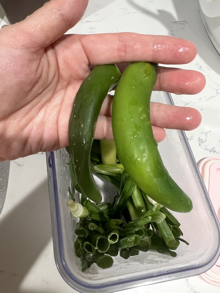 Two serrano peppers stored in a vacuum container for 25 days